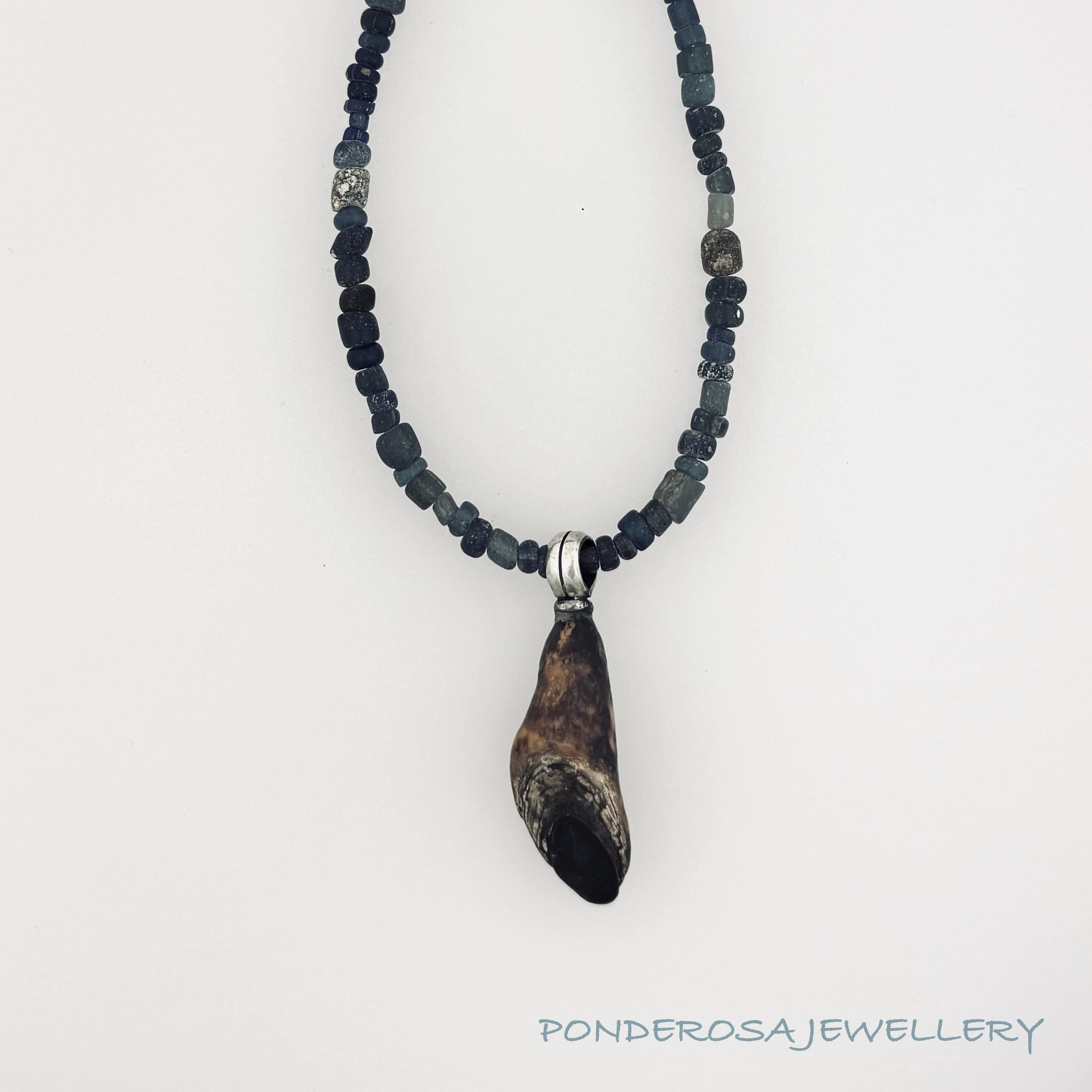 Fossilized Walrus and Ancient Roman Glass (Blue)